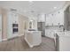 Modern kitchen with stainless steel appliances and white cabinetry at 6615 Hunter Combe Xing, University Park, FL 34201