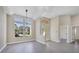 Spacious living room with large windows, hardwood floors, and high ceilings at 6615 Hunter Combe Xing, University Park, FL 34201