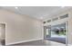 Living area with sliding glass doors opening to the pool and patio at 6615 Hunter Combe Xing, University Park, FL 34201