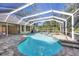 Inviting screened pool and spa with brick pavers at 6615 Hunter Combe Xing, University Park, FL 34201