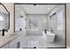 Spa-like shower with marble tile and frameless glass enclosure at 6615 Hunter Combe Xing, University Park, FL 34201