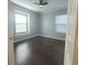 Spacious bedroom featuring hardwood floors and window at 7321 Black Walnut Way, Lakewood Rch, FL 34202