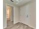 Entryway with wood-look floors and access to bathroom at 1002 Hagle Park Rd, Bradenton, FL 34212