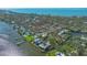 Aerial view of waterfront property with large home and private dock at 1249 S Basin Ln, Sarasota, FL 34242