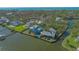 Prime waterfront property with two houses and a dock at 1249 S Basin Ln, Sarasota, FL 34242