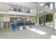 Bright, open interior with soaring ceilings, a library, and comfortable seating area at 1249 S Basin Ln, Sarasota, FL 34242