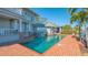 Resort-style pool and brick patio perfect for outdoor entertaining at 1249 S Basin Ln, Sarasota, FL 34242