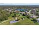 Aerial view showing the home's location near a lake and recreational facilities at 13122 50Th E Ct, Parrish, FL 34219