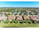 Bird's-eye view of a lakefront community with many homes at 16920 Pelham Pl, Bradenton, FL 34202