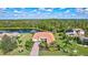 Luxury property on a lake with mature trees and other homes nearby at 17113 1St E Dr, Bradenton, FL 34212