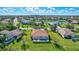 Aerial view of house and community, showcasing backyard pool at 17113 1St E Dr, Bradenton, FL 34212