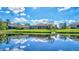 Stunning backyard oasis with lake view and lush landscaping at 17113 1St E Dr, Bradenton, FL 34212