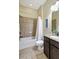 Bathroom with tub shower combo and granite countertop vanity at 17113 1St E Dr, Bradenton, FL 34212