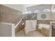 Bathroom with walk-in shower, soaking tub, and double vanity at 17113 1St E Dr, Bradenton, FL 34212