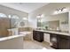 Luxurious bathroom with double vanity and soaking tub at 17113 1St E Dr, Bradenton, FL 34212