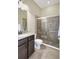 Bathroom with shower and granite vanity at 17113 1St E Dr, Bradenton, FL 34212