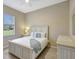 Bright bedroom with a queen-size bed and ample closet space at 17113 1St E Dr, Bradenton, FL 34212