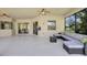 Covered patio with seating area and access to interior at 17113 1St E Dr, Bradenton, FL 34212