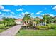 Single-Gathering home with landscaped yard and driveway at 17113 1St E Dr, Bradenton, FL 34212