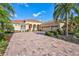 Home with three-car garage and paver driveway at 17113 1St E Dr, Bradenton, FL 34212