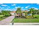 Single-Gathering home with landscaped yard and driveway at 17113 1St E Dr, Bradenton, FL 34212