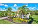 Landscaped yard with lush tropical plants and a one-story home at 17113 1St E Dr, Bradenton, FL 34212