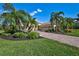 Single-Gathering home with landscaped yard and driveway at 17113 1St E Dr, Bradenton, FL 34212