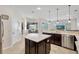 Spacious kitchen with island, granite countertops, and stainless steel appliances at 17113 1St E Dr, Bradenton, FL 34212
