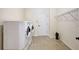 Laundry room with washer, dryer, and shelving at 17113 1St E Dr, Bradenton, FL 34212