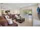 Living area boasts sliding doors to outdoor patio at 17113 1St E Dr, Bradenton, FL 34212