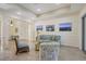 Living area featuring a light blue sofa and two armchairs at 17113 1St E Dr, Bradenton, FL 34212