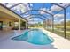 Screened-in pool and patio area overlooking a lake at 17113 1St E Dr, Bradenton, FL 34212