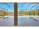 Relaxing pool area with screened enclosure and tranquil water feature at 17113 1St E Dr, Bradenton, FL 34212