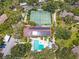 Aerial view of community pool, tennis courts and solar panels at 1720 Glenhouse Dr # 330, Sarasota, FL 34231