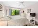 Bedroom with queen bed, window, and plenty of natural light at 1720 Glenhouse Dr # 330, Sarasota, FL 34231