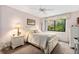 Light and airy bedroom with a queen-size bed and window seat at 1720 Glenhouse Dr # 330, Sarasota, FL 34231