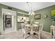 Charming dining area with a glass-top table and white chairs at 1720 Glenhouse Dr # 330, Sarasota, FL 34231