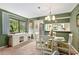 Bright dining area with a glass-top table and white chairs at 1720 Glenhouse Dr # 330, Sarasota, FL 34231