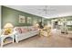 Comfortable living room with a sofa and arm chair, open to dining area at 1720 Glenhouse Dr # 330, Sarasota, FL 34231