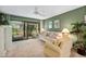 Relaxing living room featuring a comfy sofa and access to a patio at 1720 Glenhouse Dr # 330, Sarasota, FL 34231