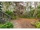 Pathway through lush landscaping and trees at 1720 Glenhouse Dr # 330, Sarasota, FL 34231