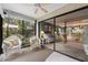 Sunroom with view of the living room and garden at 1720 Glenhouse Dr # 330, Sarasota, FL 34231