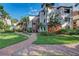 Brick pathway leading to condo building entrance at 1800 Cove Ii Pl # 213, Sarasota, FL 34242