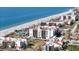 Aerial view of condo community near the beach, featuring multiple buildings at 1945 Gulf Of Mexico Dr # M2-206, Longboat Key, FL 34228