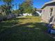 Large backyard with mostly grass and a shed at 21459 Olean Blvd, Port Charlotte, FL 33952