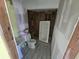 Bathroom with new flooring, toilet and sink; bathtub awaiting installation at 21459 Olean Blvd, Port Charlotte, FL 33952