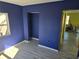 Serene bedroom painted in blue with a closet and new flooring at 21459 Olean Blvd, Port Charlotte, FL 33952