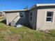 Side of the house with AC unit and some construction materials at 21459 Olean Blvd, Port Charlotte, FL 33952