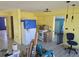 Kitchen with new flooring, appliances to be installed, and yellow walls at 21459 Olean Blvd, Port Charlotte, FL 33952