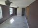 Spacious living room with new laminate flooring and fresh paint at 21459 Olean Blvd, Port Charlotte, FL 33952